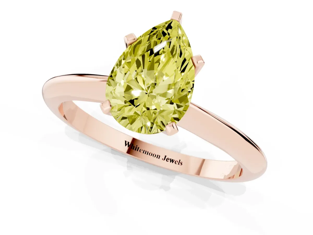 Fancy Yellow Pear Cut Cut Solitaire Ring with Four-Prong Setting on a Classic Band Rose gold