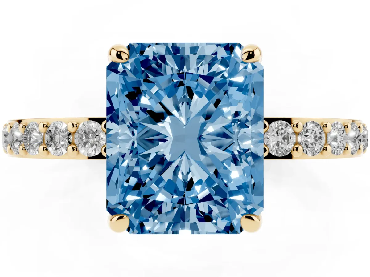 Fancy Blue Radiant Cut Diamond Pavé Engagement Ring with Round Accents and Prong Setting Yellow gold