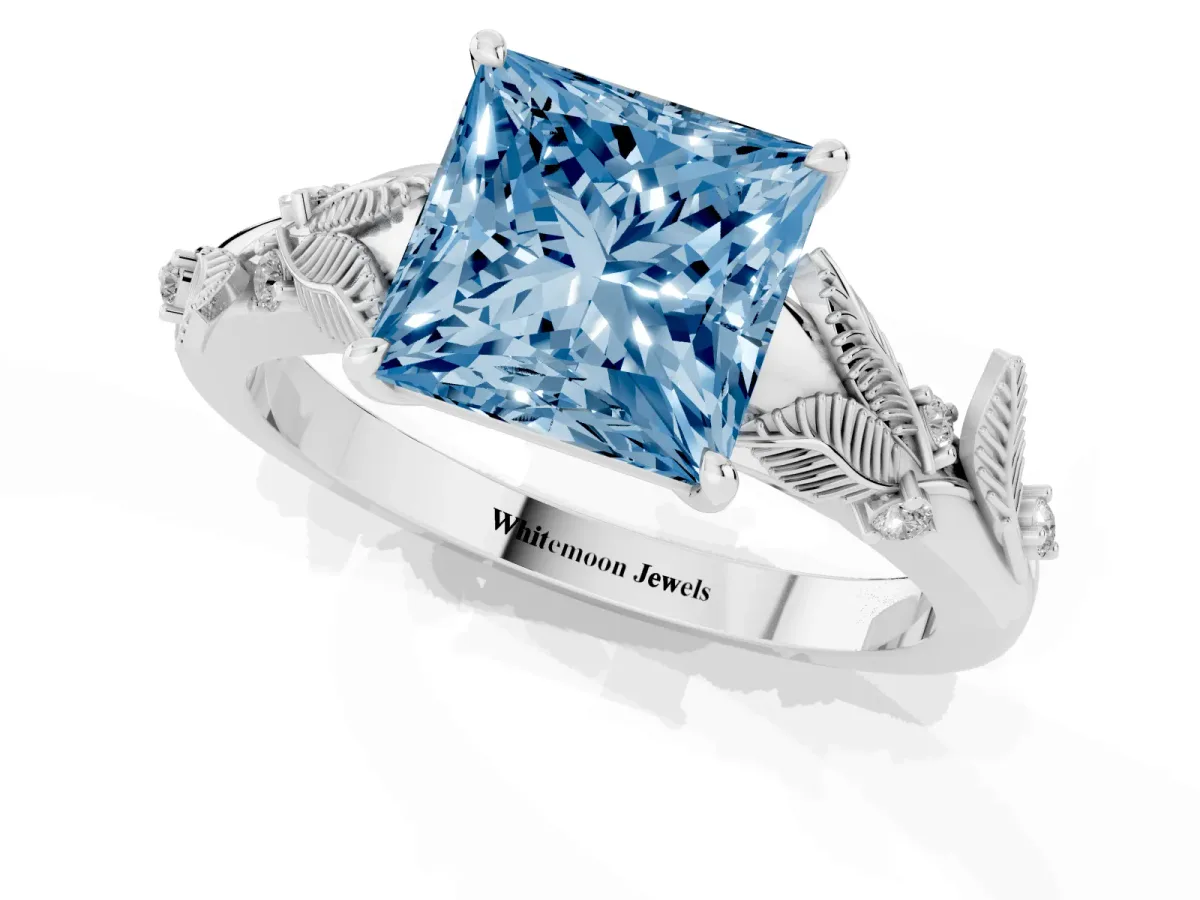 Fancy Blue Princess Cut Diamond Solitaire Ring with Leaf Motif Band and Four-Prong Setting Silver