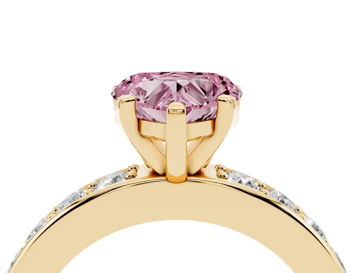 Fancy Pink Heart Cut Diamond Engagement Ring with Channel Set Round Band and Prong Setting Yellow gold