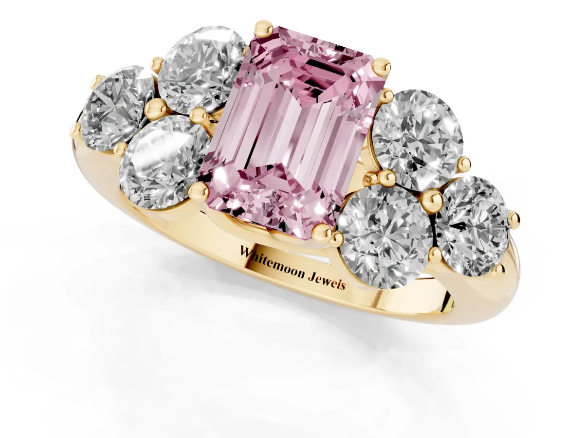 Fancy Pink Emerald Cut Cut Diamond Cluster Ring with Round Accent Stones and Prong Setting on a Classic Band Yellow gold