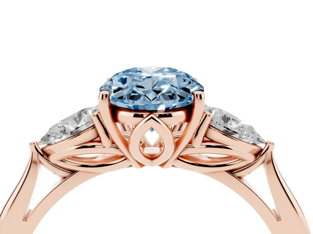 Fancy Blue Three-Stone Oval Cut Diamond Ring with Pear Side Stones in Four-Prong Setting Rose gold
