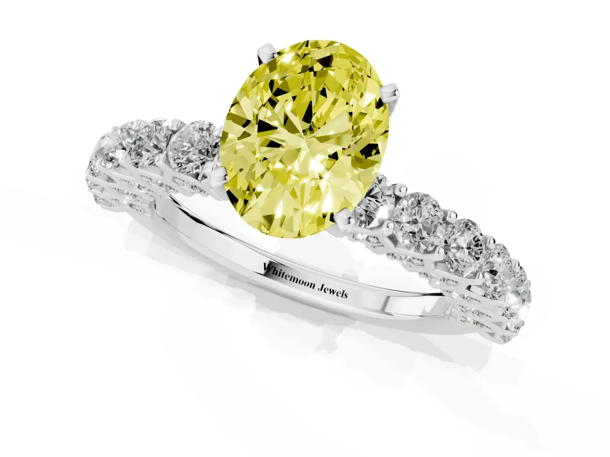 Fancy Yellow Oval Cut Diamond Solitaire Ring with Shared Prong Pavé Band and Four-Prong Setting Silver