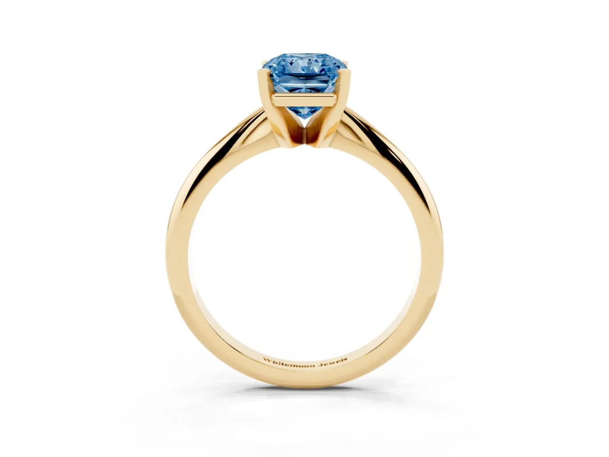 Fancy Blue Radiant Cut Cut Solitaire Ring with Four-Prong Setting on a Classic Band Yellow gold