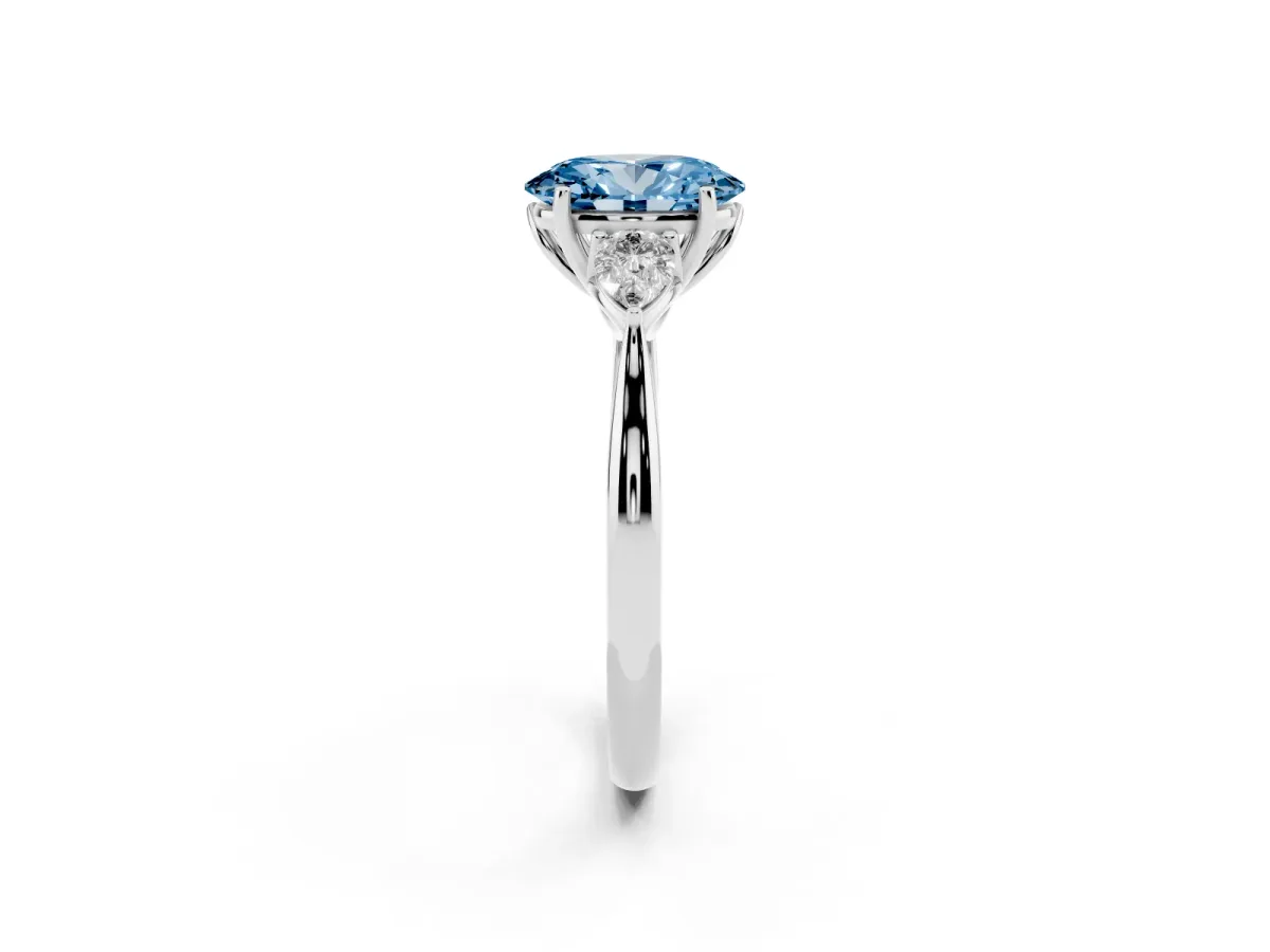 Fancy Blue Three-Stone Oval Cut Diamond Ring with Pear Side Stones in Four-Prong Setting Silver