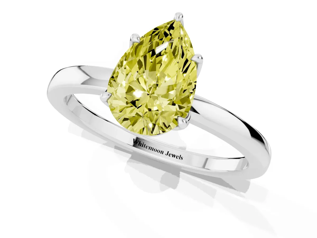Fancy Yellow Pear Cut Diamond Solitaire Ring with Thin Band and Prong Setting Silver