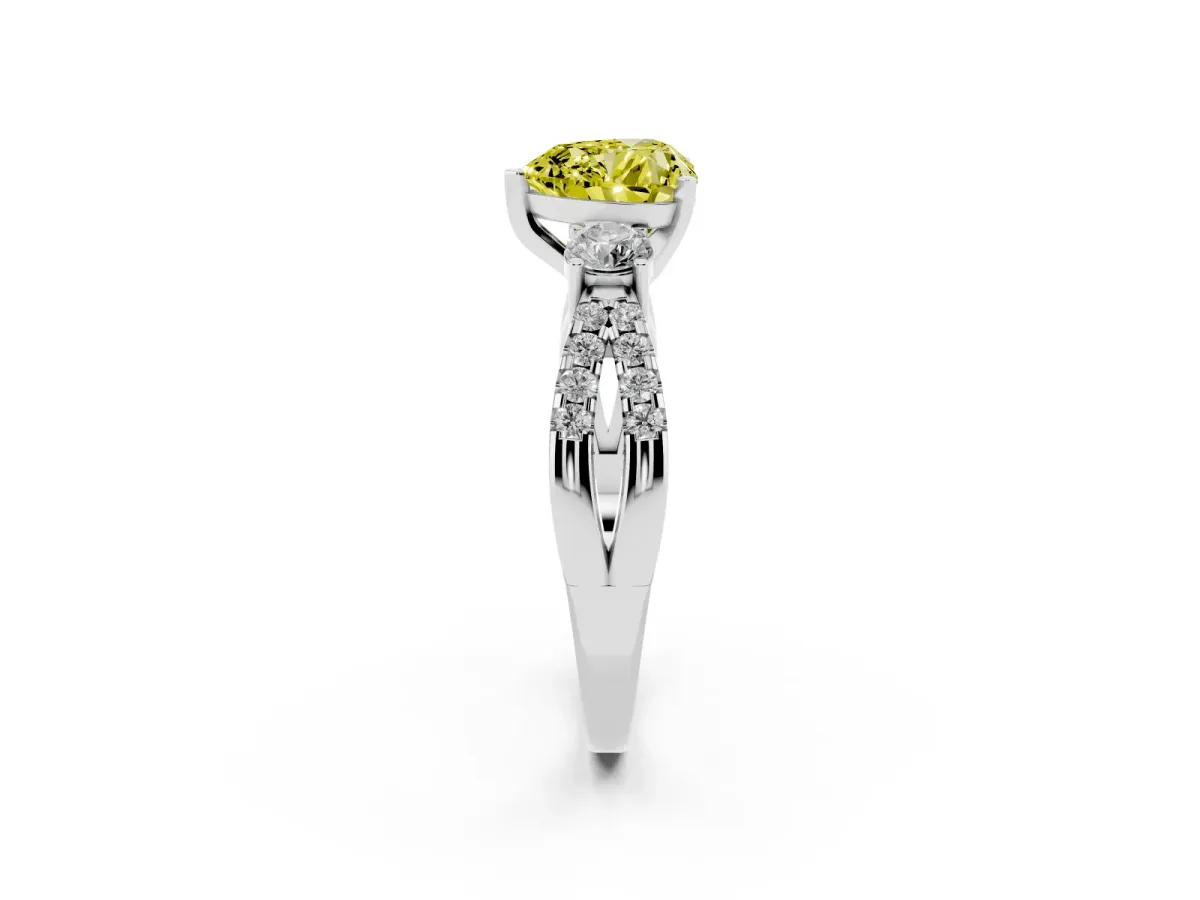 Fancy Yellow Heart Cut Diamond Three-Stone Ring with Pavé Split Shank and Four-Prong Setting Platinum