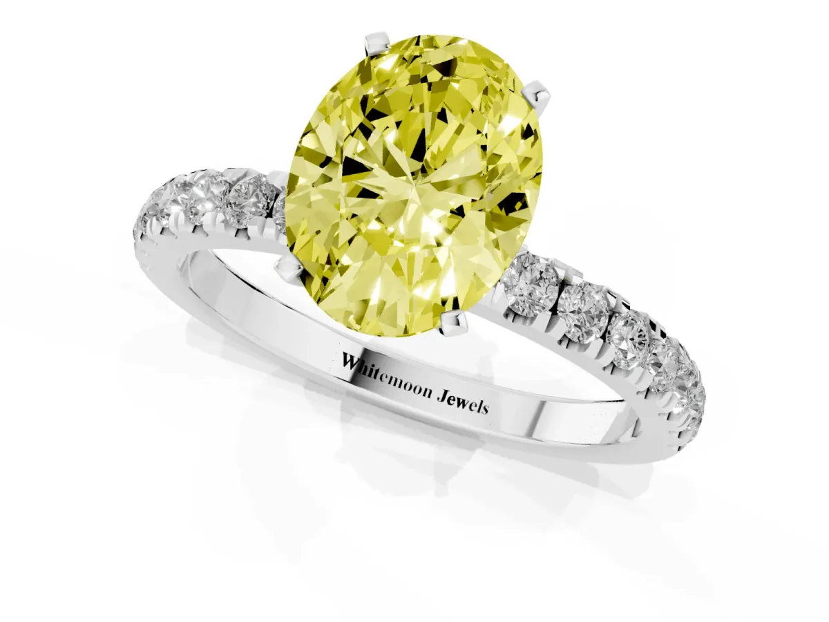 Fancy Yellow Oval Cut Diamond Solitaire Ring with Pavé Accents and Four-Prong Setting White gold