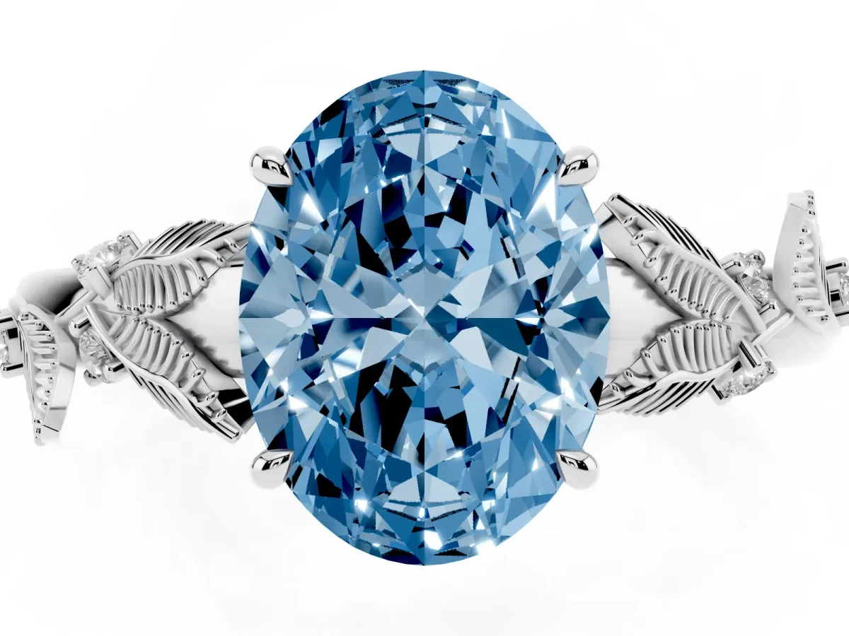 Fancy Blue Oval Cut Diamond Solitaire Ring with Leaf Motif Band and Four-Prong Setting Silver