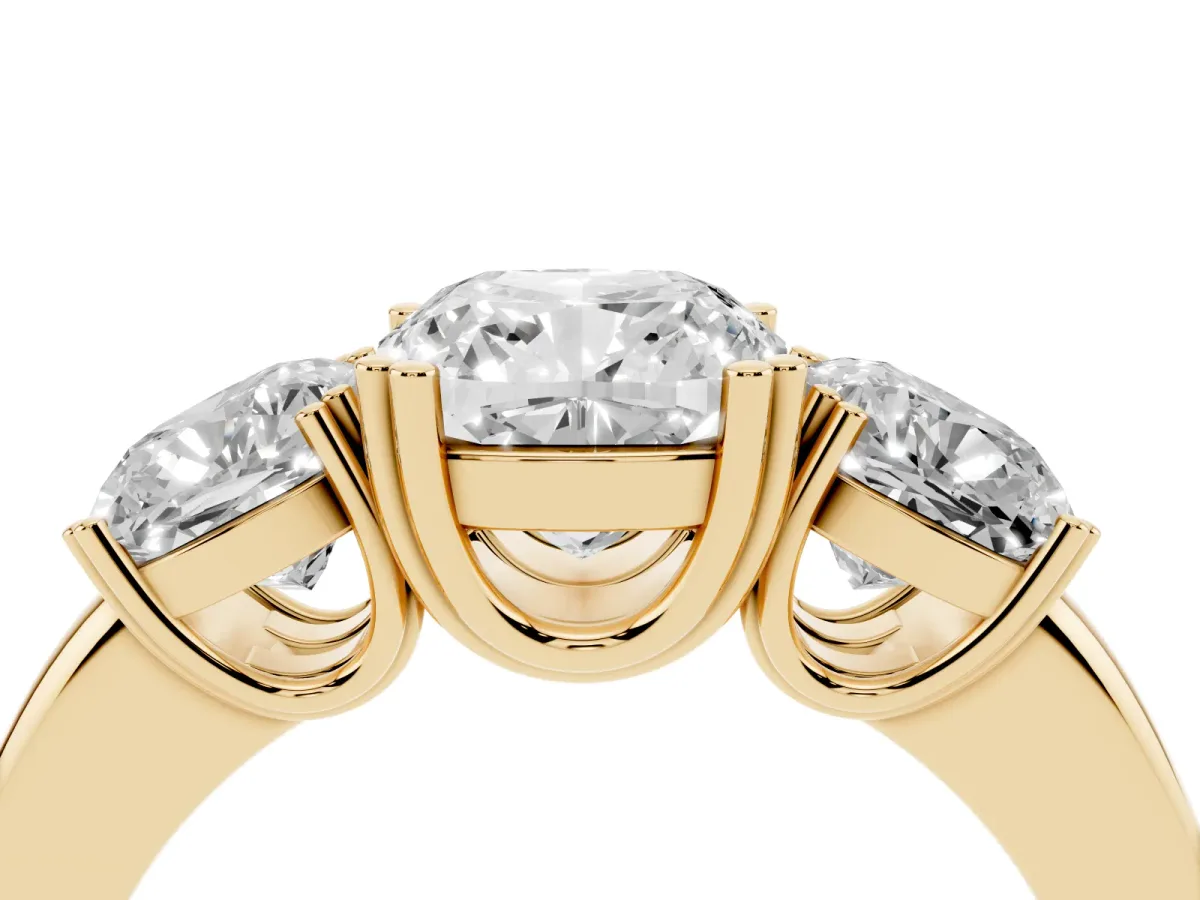 Three-Stone Cushion Cut Cut Diamond Ring with Channel Set Band and Four-Prong Setting Yellow gold