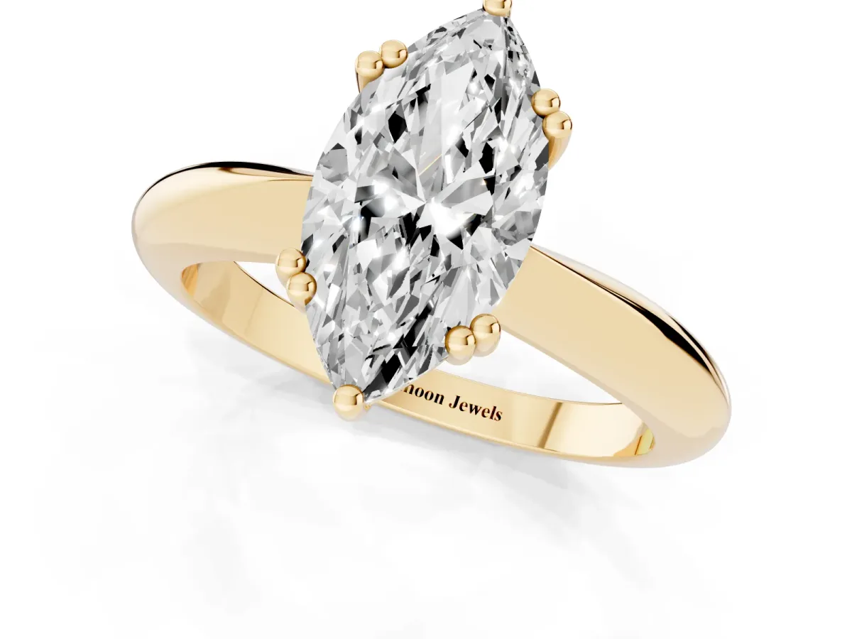 Marquise Cut Cut Solitaire Engagement Ring with Tapered Band and Four-Prong Setting Yellow gold