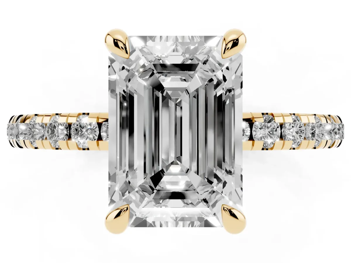 Emerald Cut Diamond Brilliant Solitaire Ring with Pavé Band and Four-Prong Setting Yellow gold