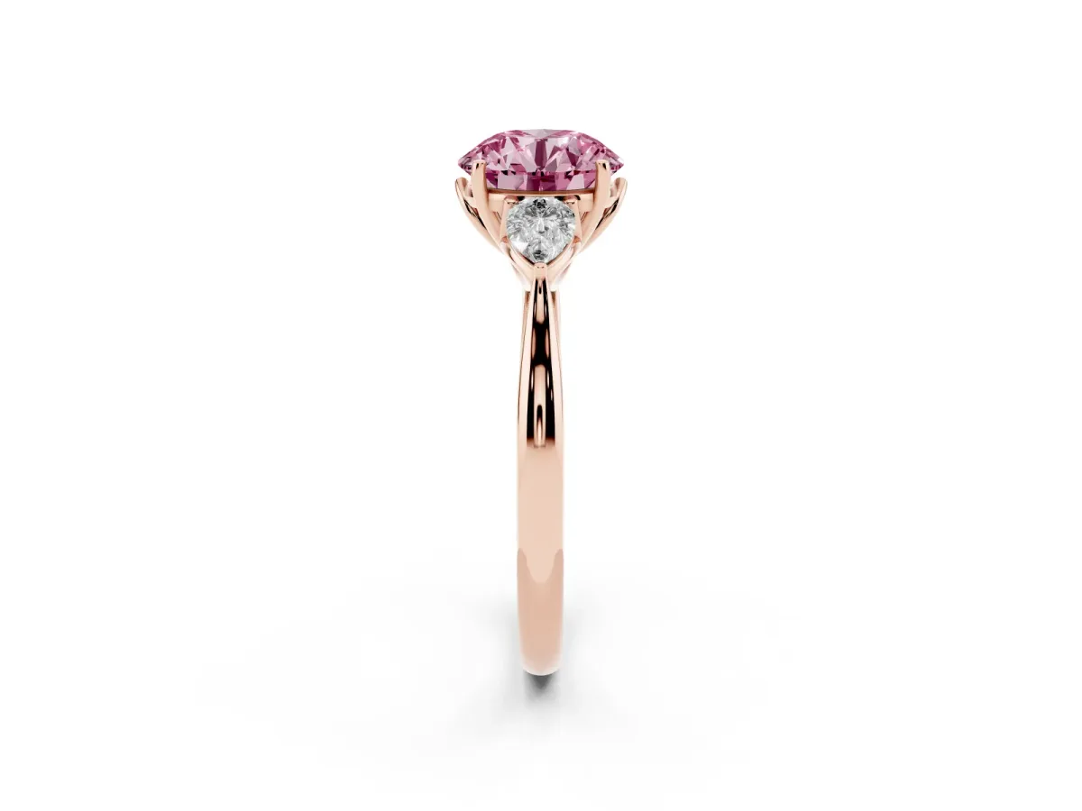 Fancy Pink Three-Stone Round Cut Brilliant Diamond Solitaire Ring with Tapered Band and Four-Prong Setting Rose gold