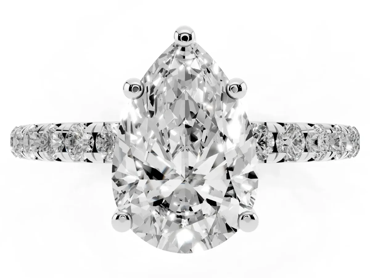Pear Cut Cut Diamond Solitaire Ring with Micro Pave Band and Four Prong Setting Silver