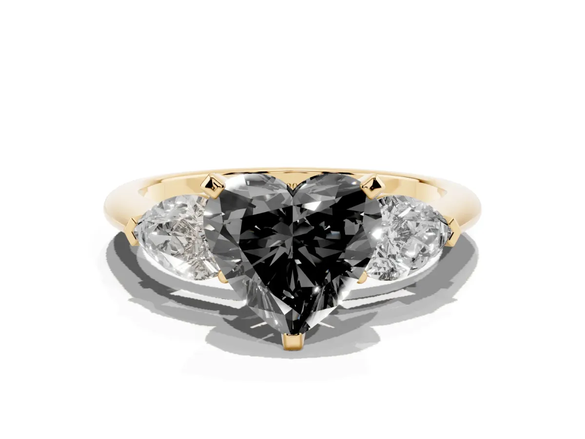 Fancy Black Three-Stone Heart Cut Diamond Ring with Pear Side Stones and Four-Prong Setting Yellow gold