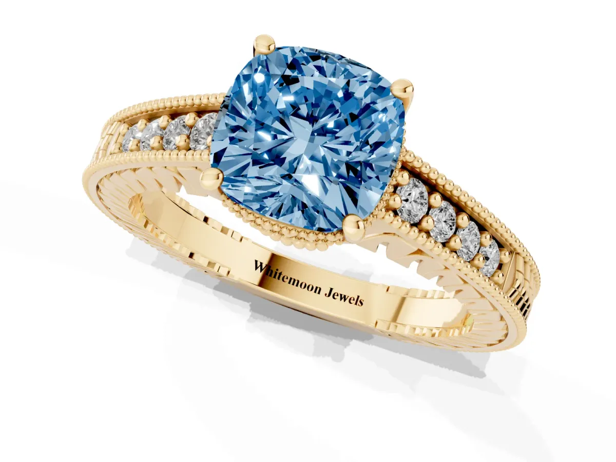 Fancy Blue Cushion Cut Solitaire Pavé Diamond Milgrain Engagement Ring with Four-Prong Setting Yellow gold