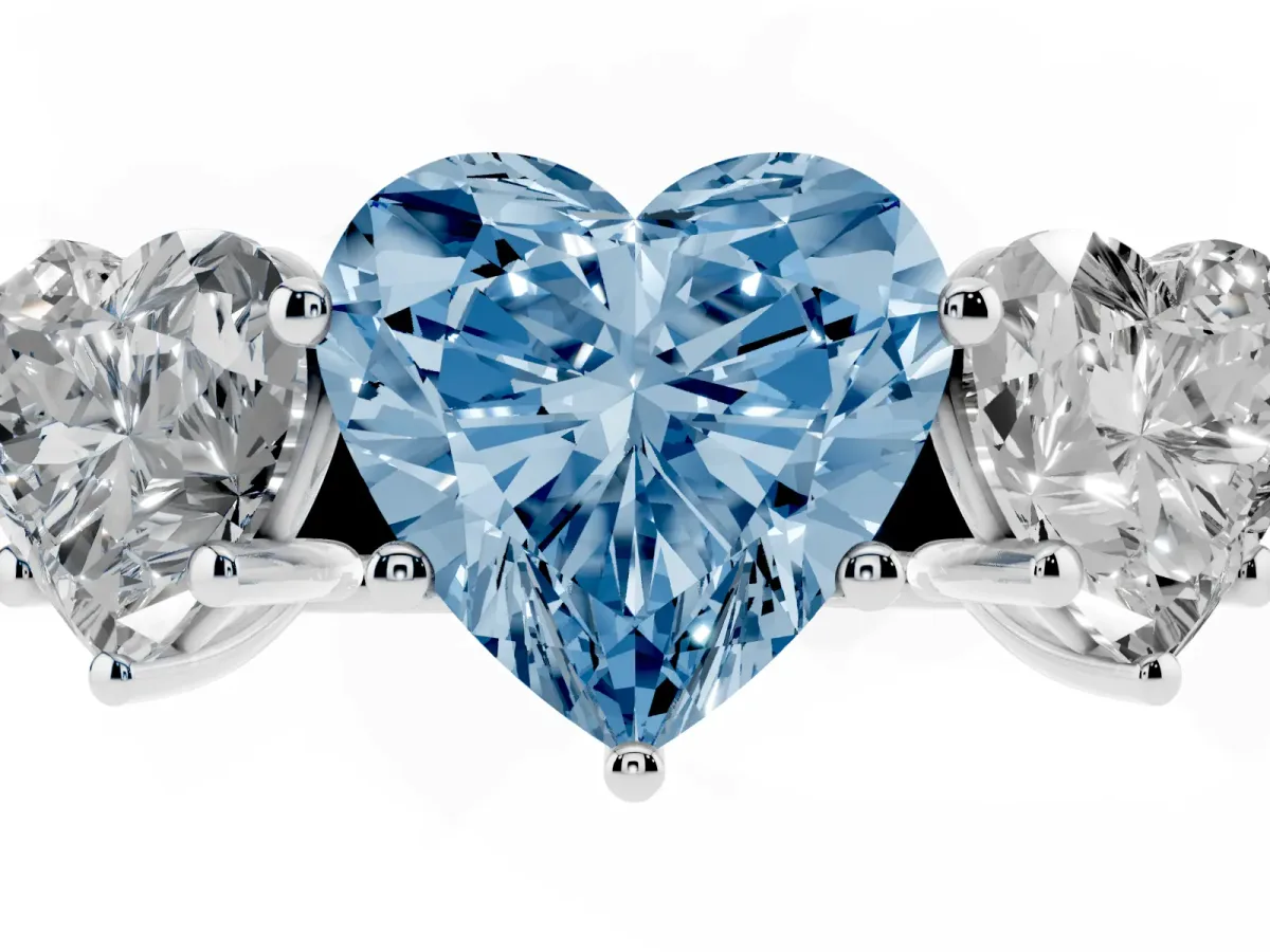 Fancy Blue Heart Cut Three-Stone Diamond Ring with Prong Setting on a Classic Band Platinum
