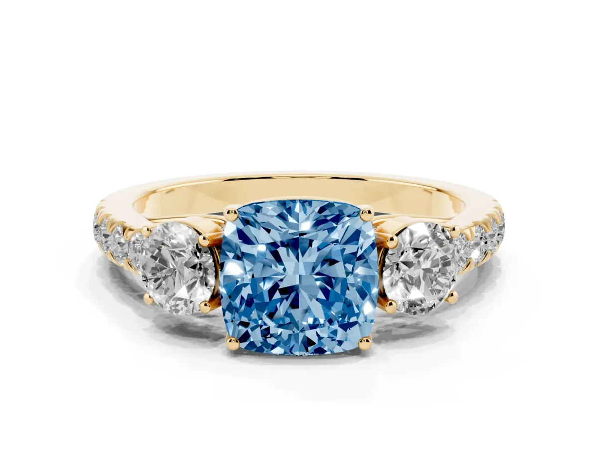 Fancy Blue Cushion Cut Cut Diamond Three-Stone Ring with Round Side Stones and Pavé Band Yellow gold