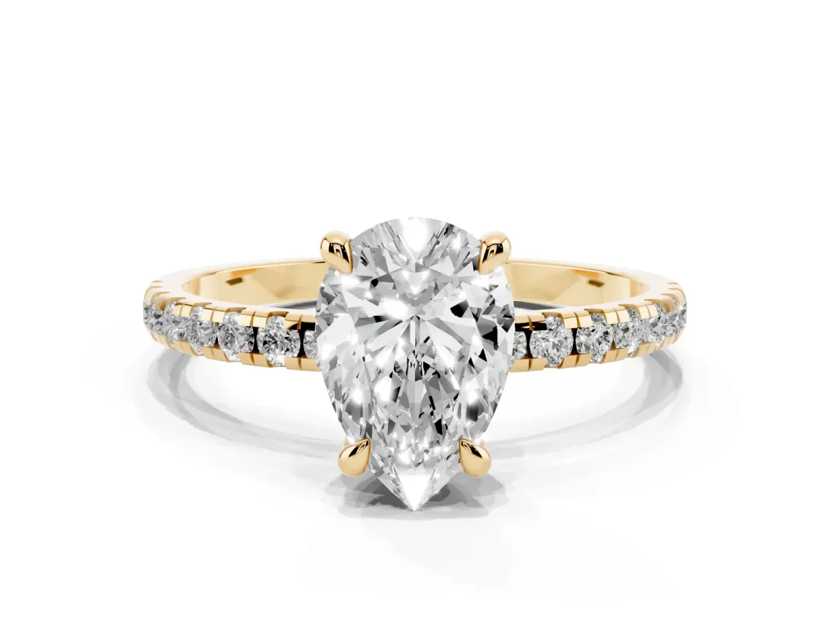 Pear Cut Diamond Brilliant Solitaire Ring with Pavé Band and Four-Prong Setting Yellow gold
