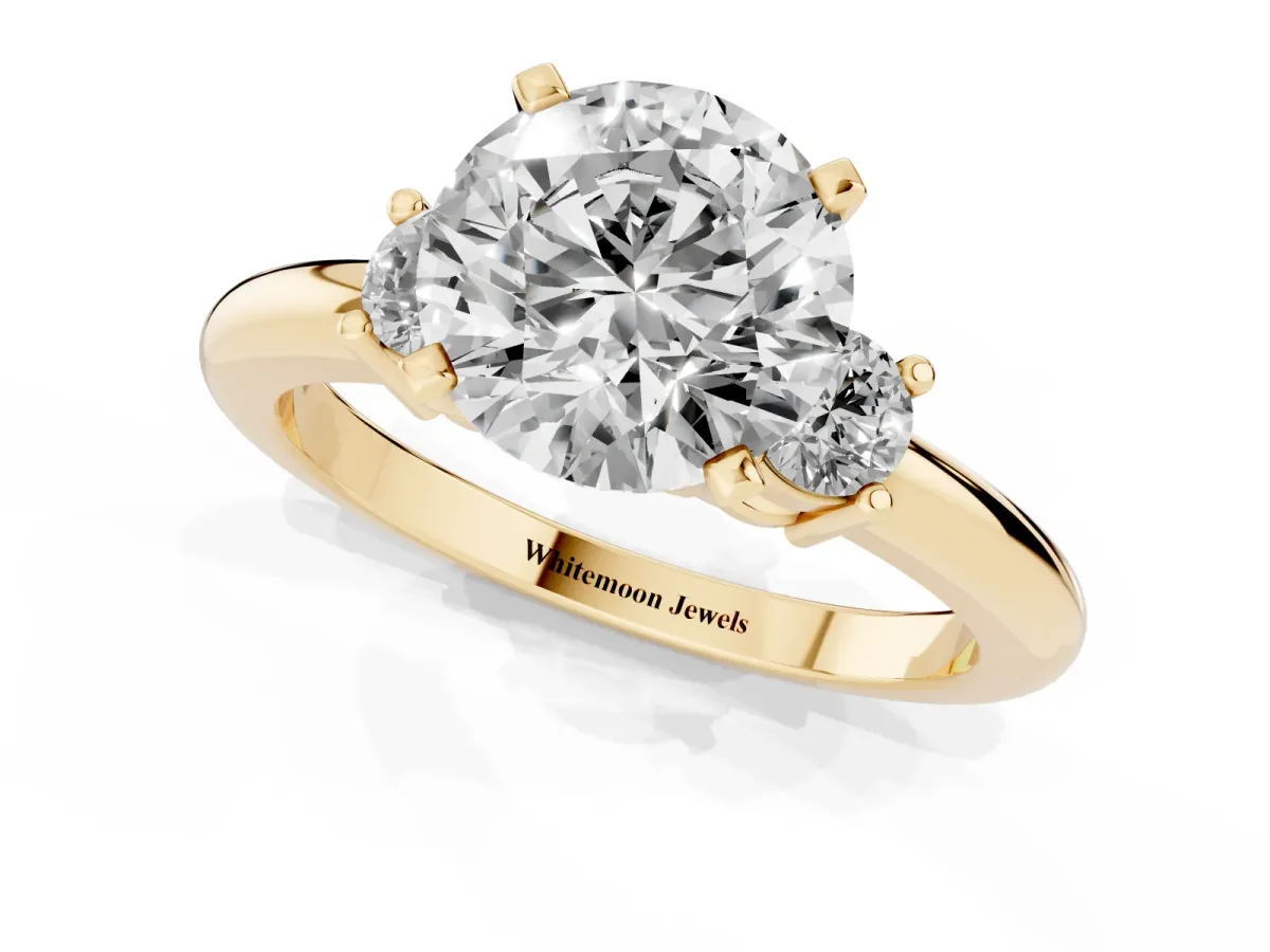 Three-Stone Round Cut Cut Diamond Solitaire with Prong Setting and Classic Band Yellow gold