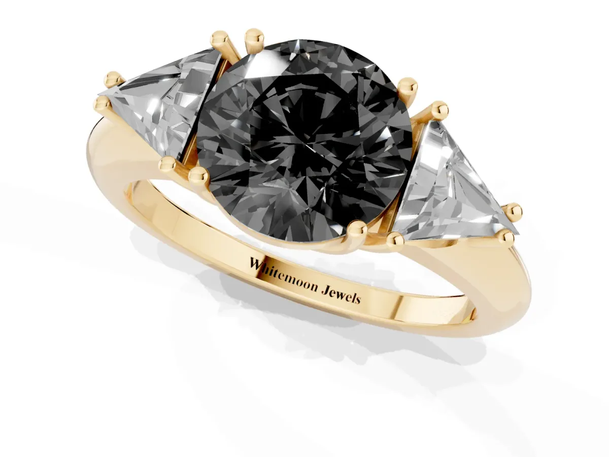 Fancy Black Three-Stone Round Cut Diamond Engagement Ring with Trillion Side Stones and Prong Setting Yellow gold