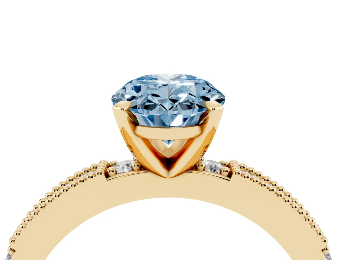 Fancy Blue Oval Cut Solitaire with Pavé Band and Four-Prong Setting Yellow gold