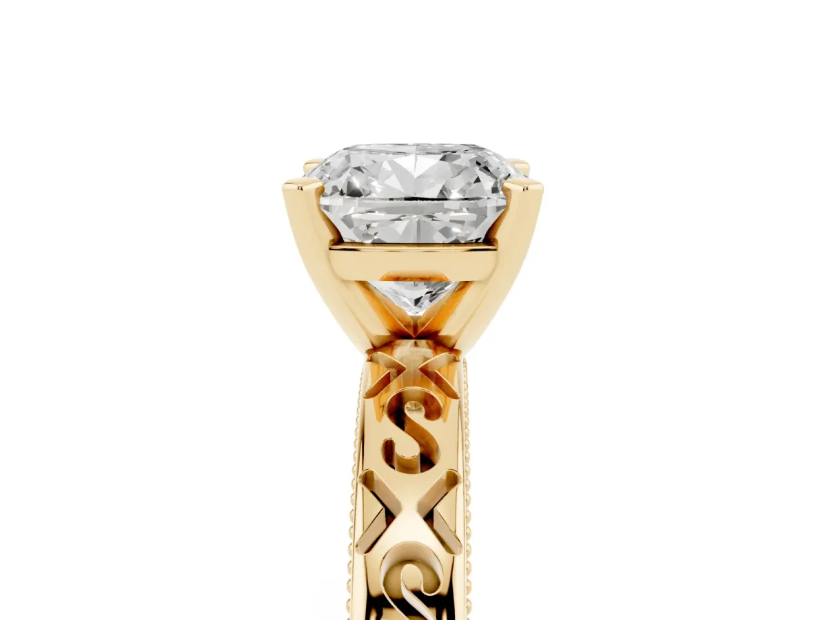Cushion Cut Solitaire Engagement Ring with Scrollwork Band and Four-Prong Setting Yellow gold