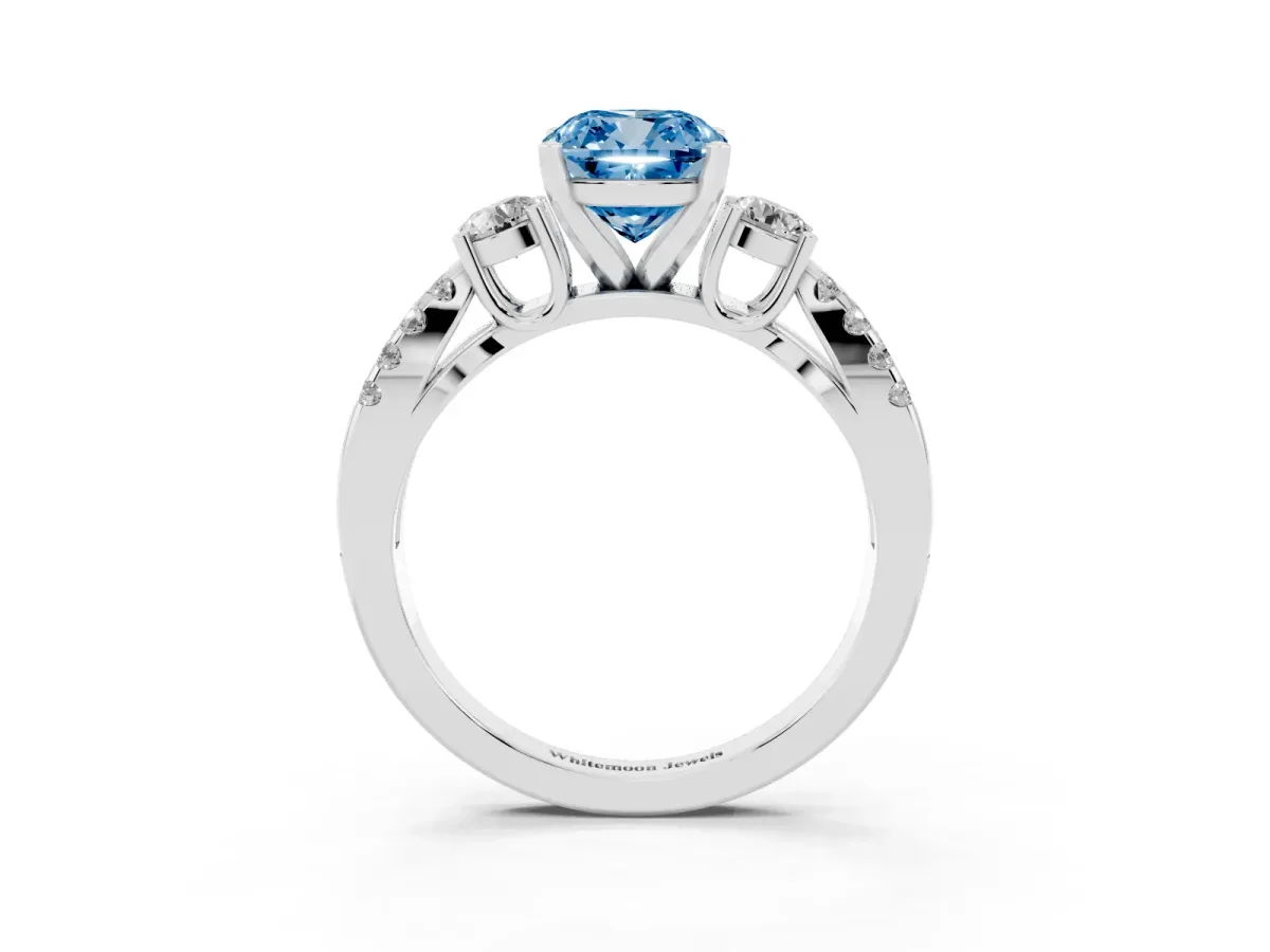 Fancy Blue Cushion Cut Diamond Three-Stone Ring with Pavé Split Shank and Four-Prong Setting Silver
