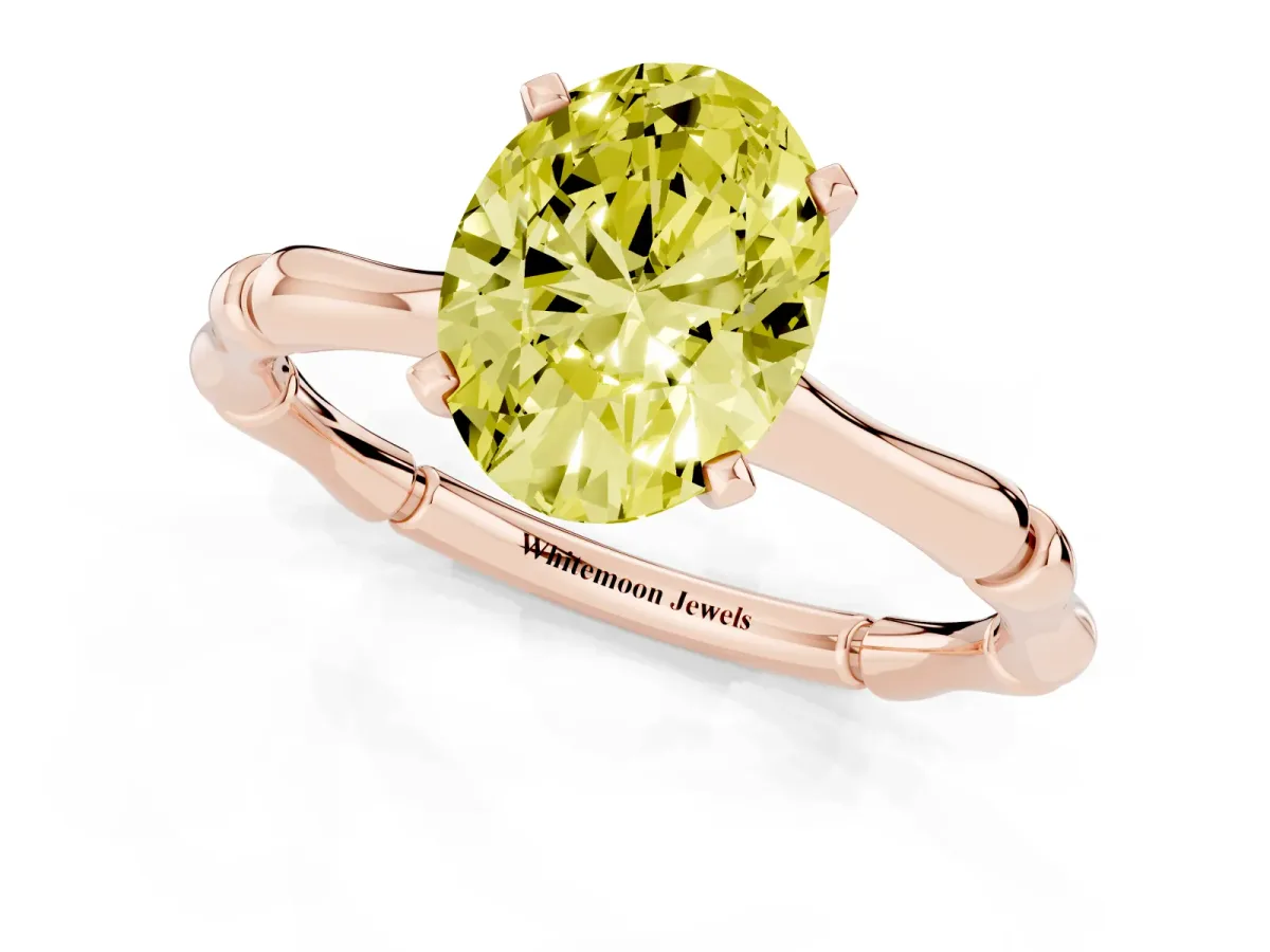 Fancy Yellow Oval Cut Solitaire Diamond Ring with Bamboo Band and Four-Prong Setting Rose gold