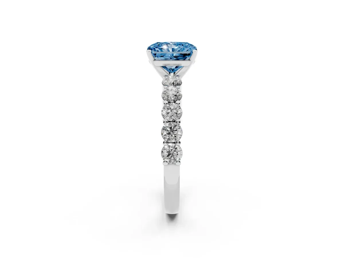 Fancy Blue Radiant Cut Diamond Solitaire Ring with Shared Prong Round Side Stones Platinum
