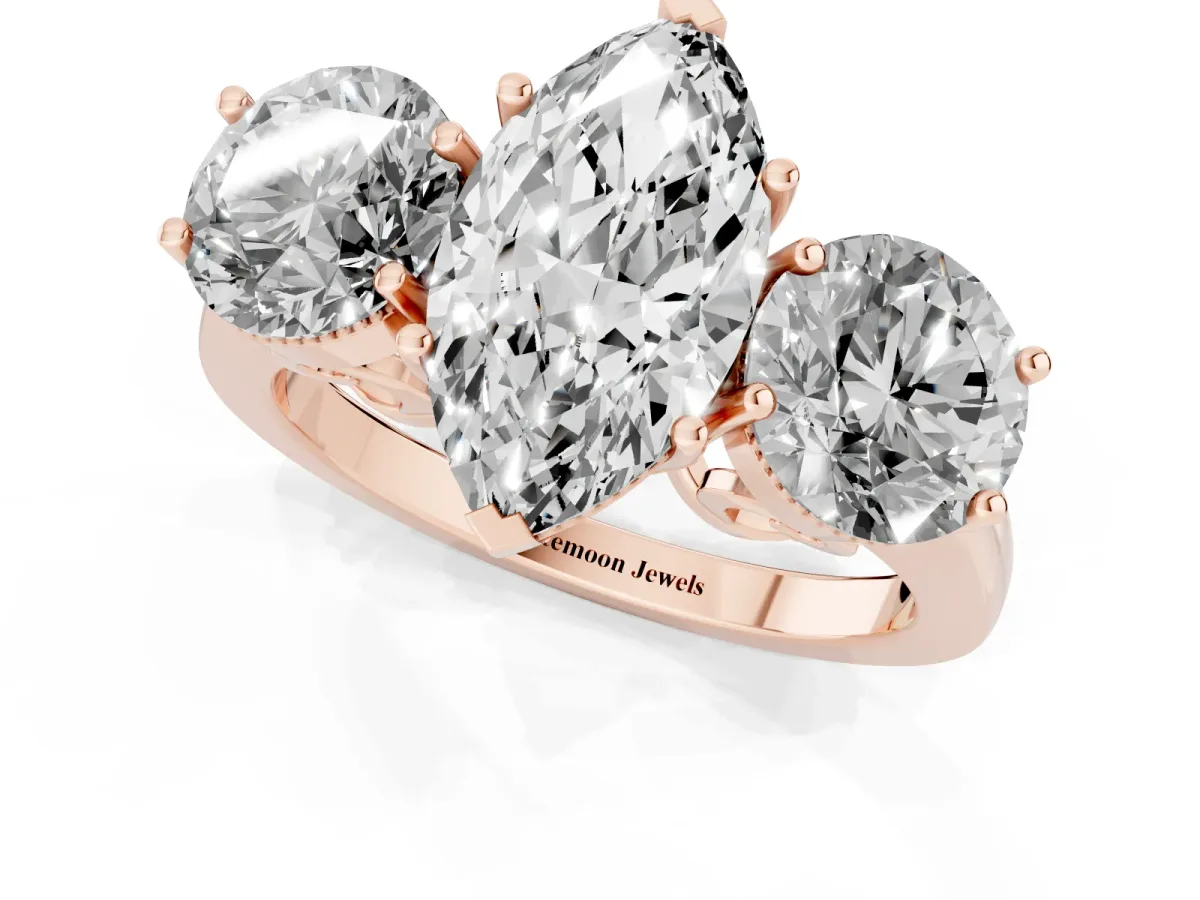 Three-Stone Marquise Cut Diamond Engagement Ring with Prong Setting on a Classic Band Rose gold