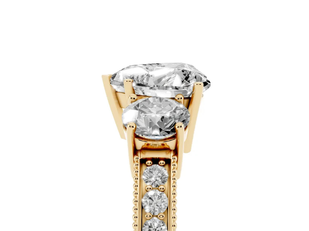 Heart Cut Three-Stone Diamond Ring with Pavé Band and Four-Prong Setting Yellow gold