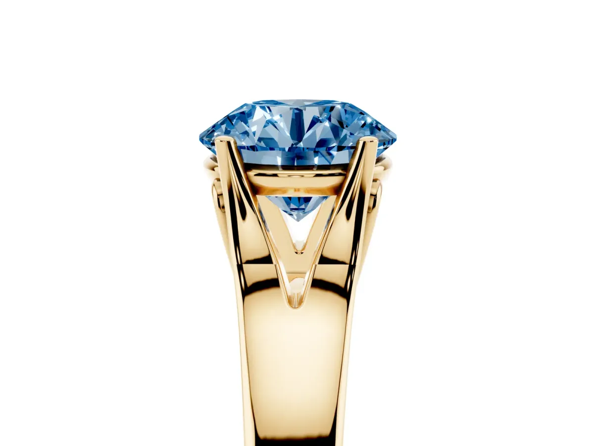 Fancy Blue Round Cut Solitaire Diamond Ring with Cathedral Band and Four-Prong Setting Yellow gold