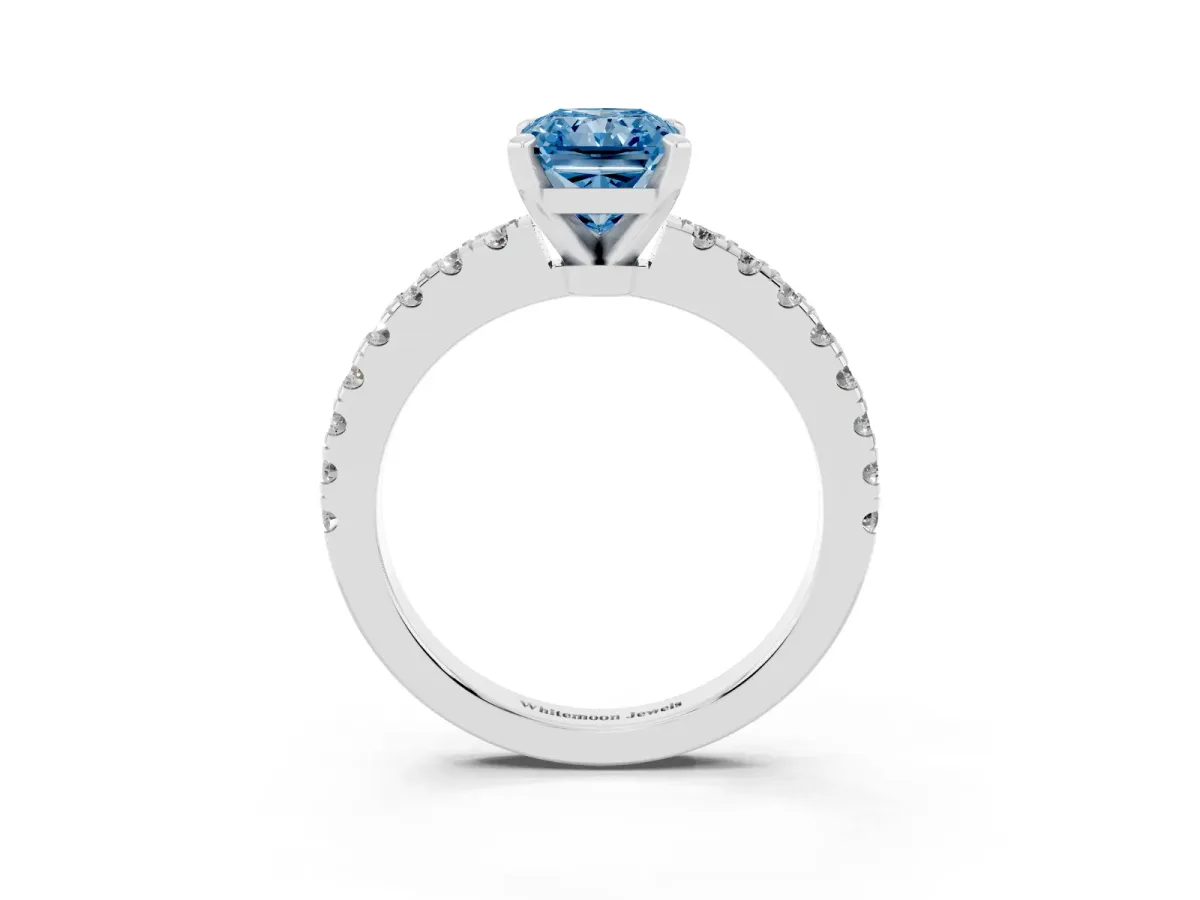 Fancy Blue Radiant Cut Solitaire Diamond with Pavé Band and Four-Prong Setting Platinum