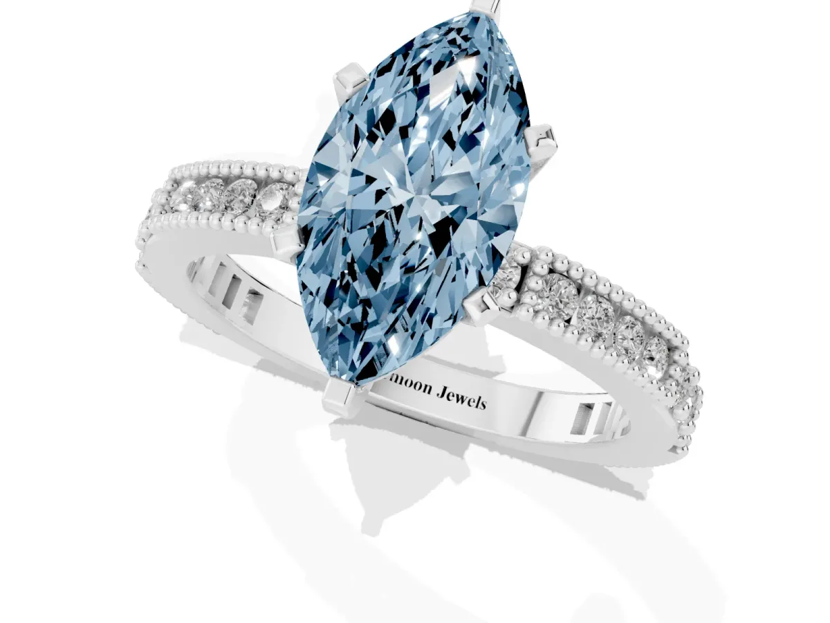 Fancy Blue Marquise Cut Solitaire with Pavé Band and Four-Prong Setting Silver