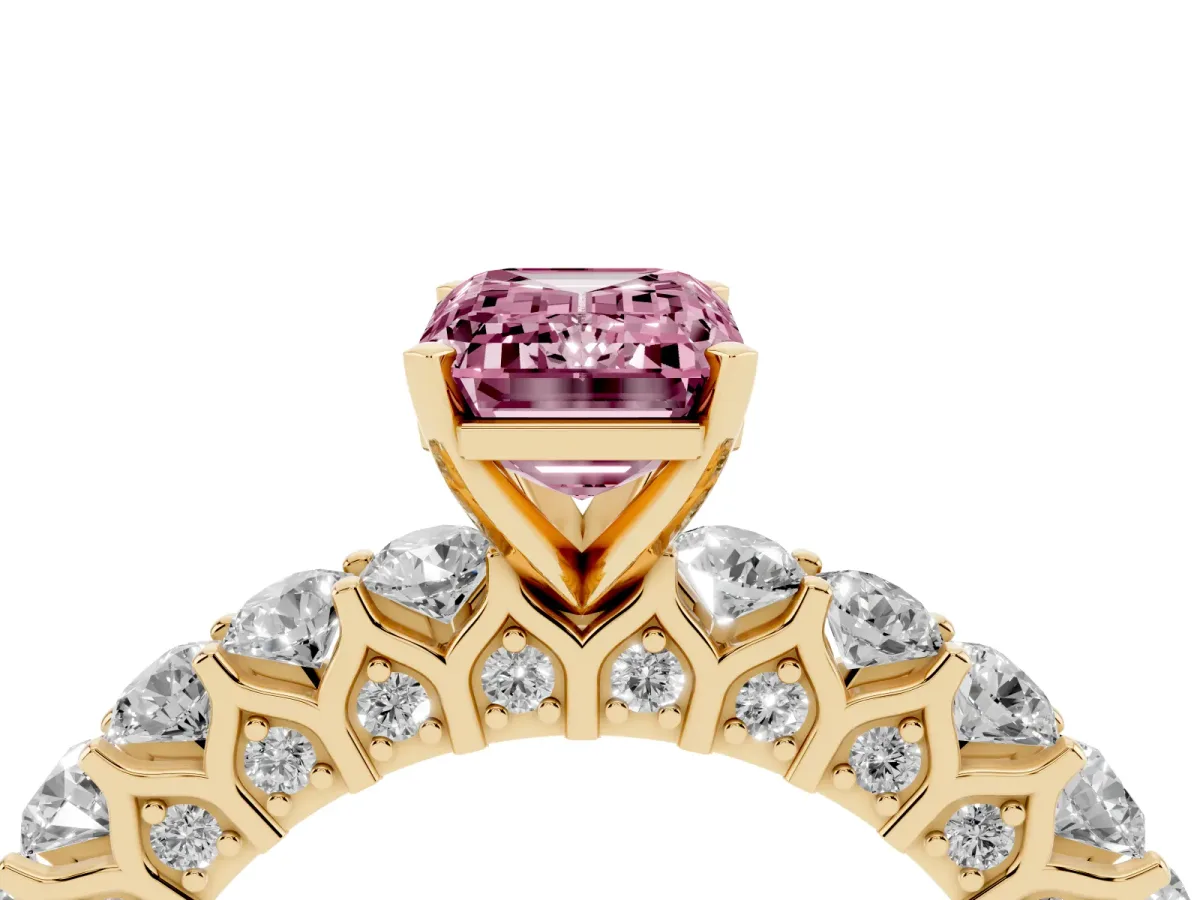 Fancy Pink Emerald Cut Diamond Solitaire Ring with Shared Prong Pavé Band and Four-Prong Setting Yellow gold