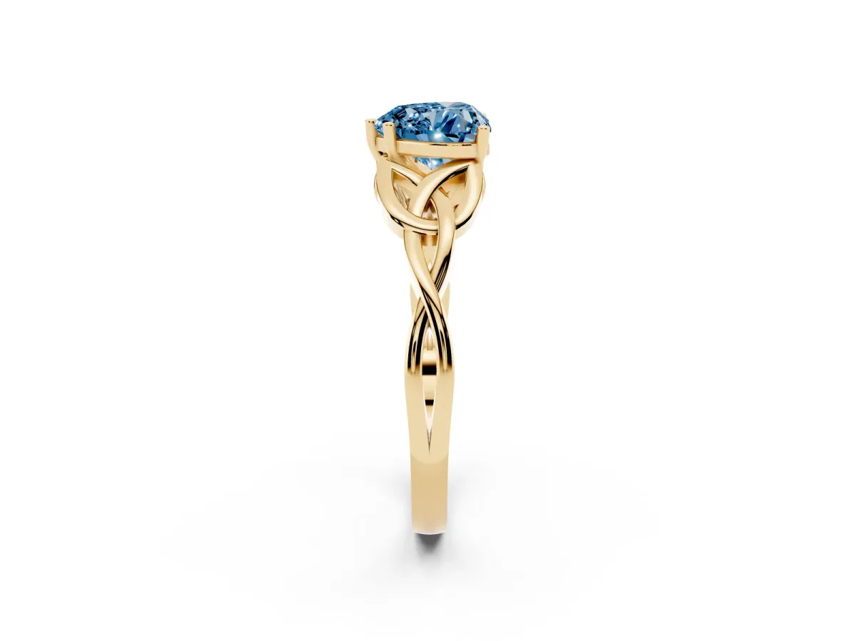 Fancy Blue Heart Cut Diamond Solitaire Engagement Ring with Celtic Knot Band and Four-Prong Setting Yellow gold