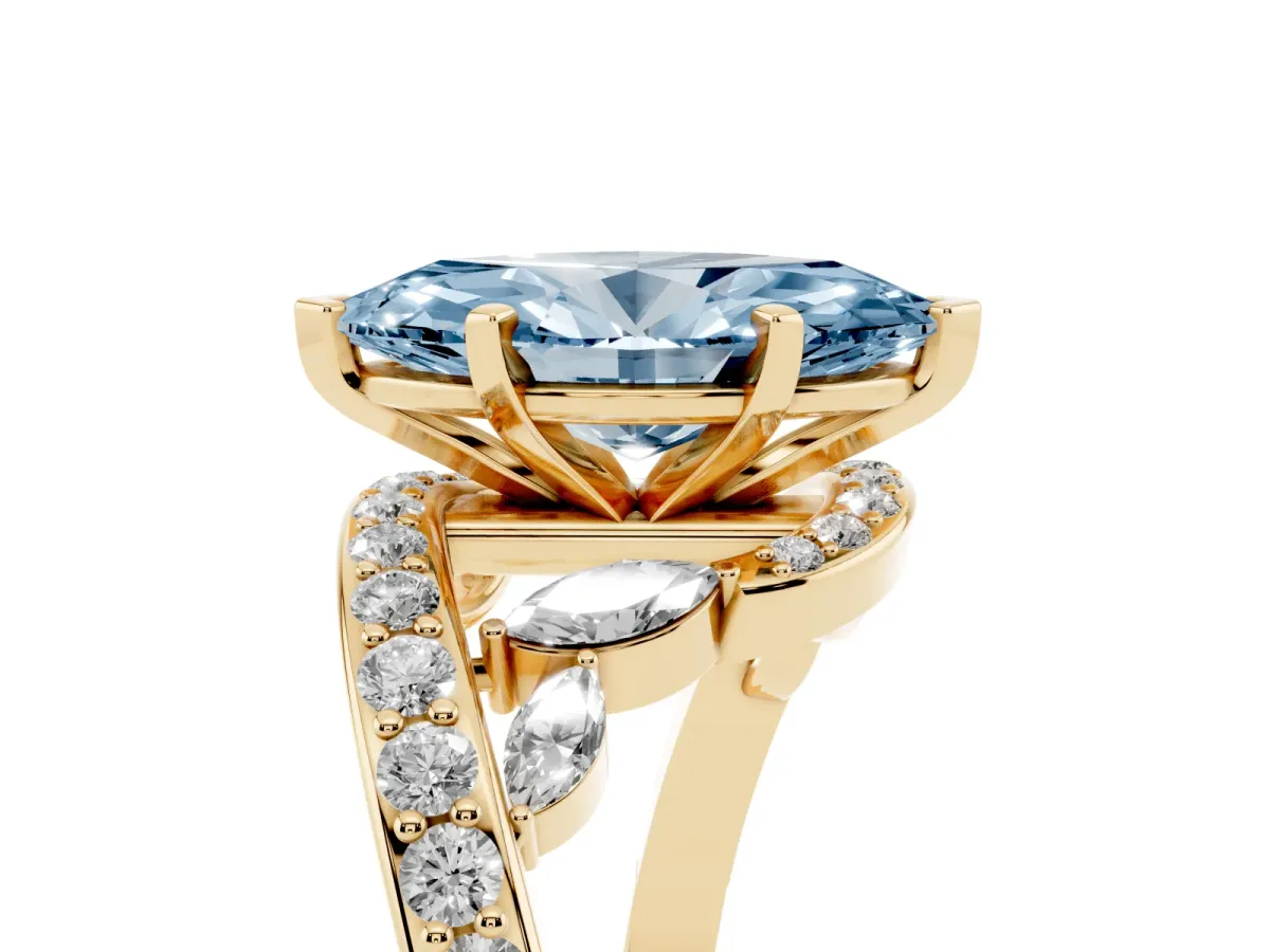 Fancy Blue Marquise Cut Solitaire with Pavé Twist Band and Four-Prong Setting Yellow gold