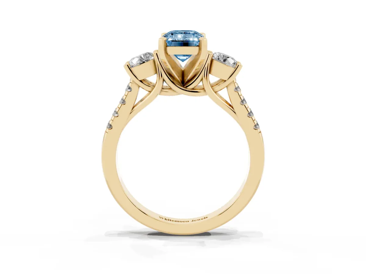 Fancy Blue Three-Stone Emerald Cut Diamond Pavé Band with Four-Prong Setting Yellow gold