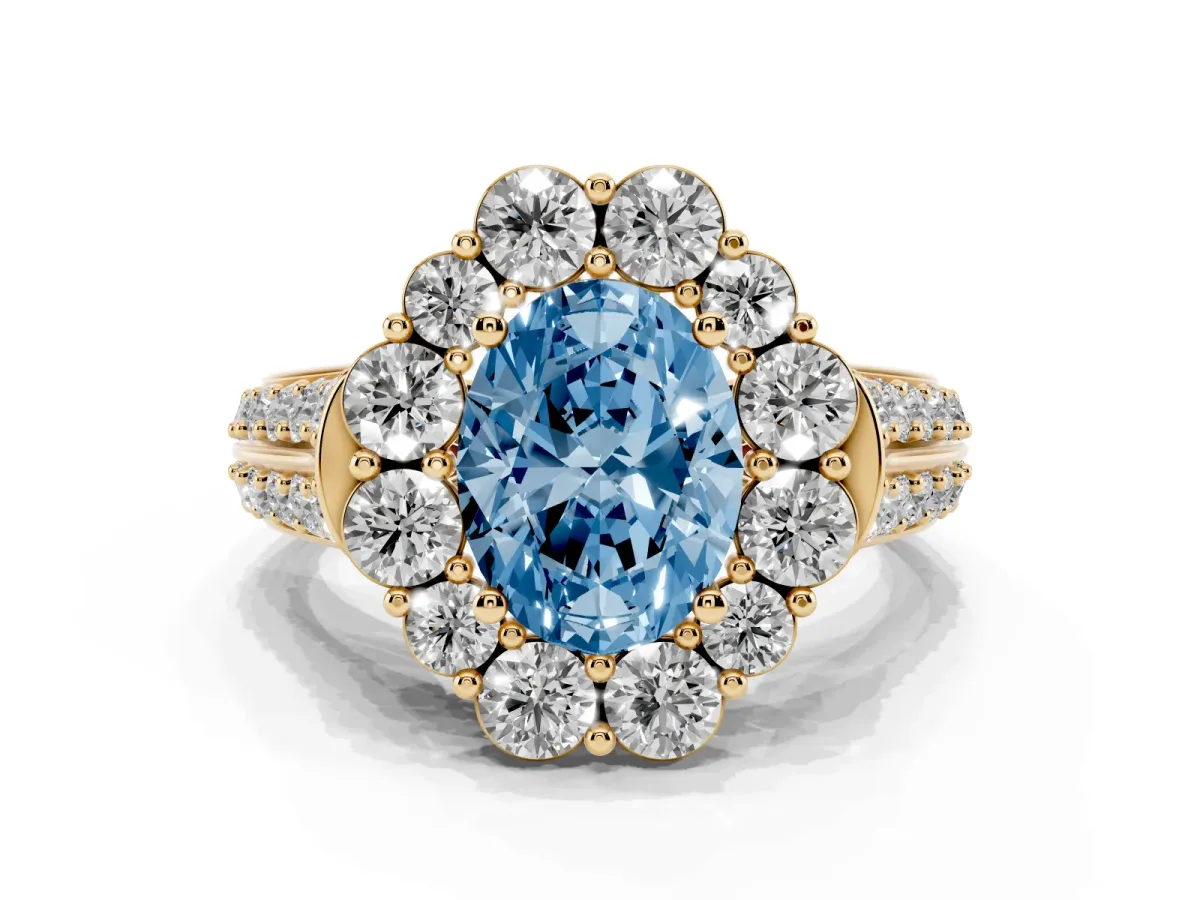 Fancy Blue Oval Cut Halo Diamond Engagement Ring with Split Shank and Prong Setting Yellow gold