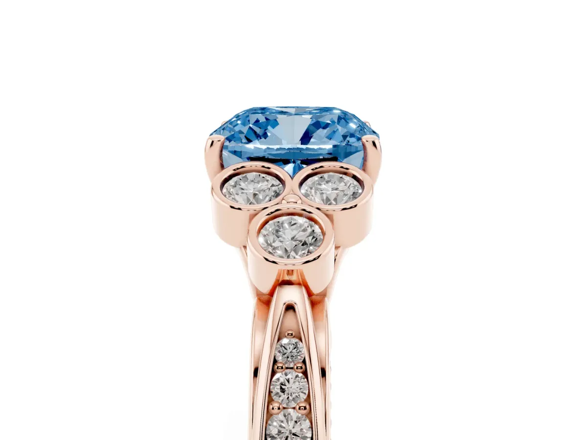 Fancy Blue Cushion Cut Cut Diamond Engagement Ring with Bezel Set Round Side Stones and Prong Setting Rose gold