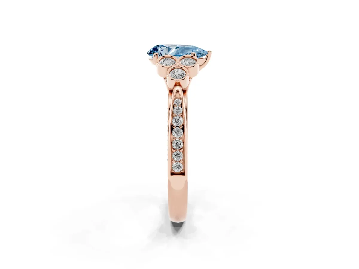 Fancy Blue Pear Cut Cut Diamond Engagement Ring with Bezel Set Round Side Stones and Prong Setting Rose gold