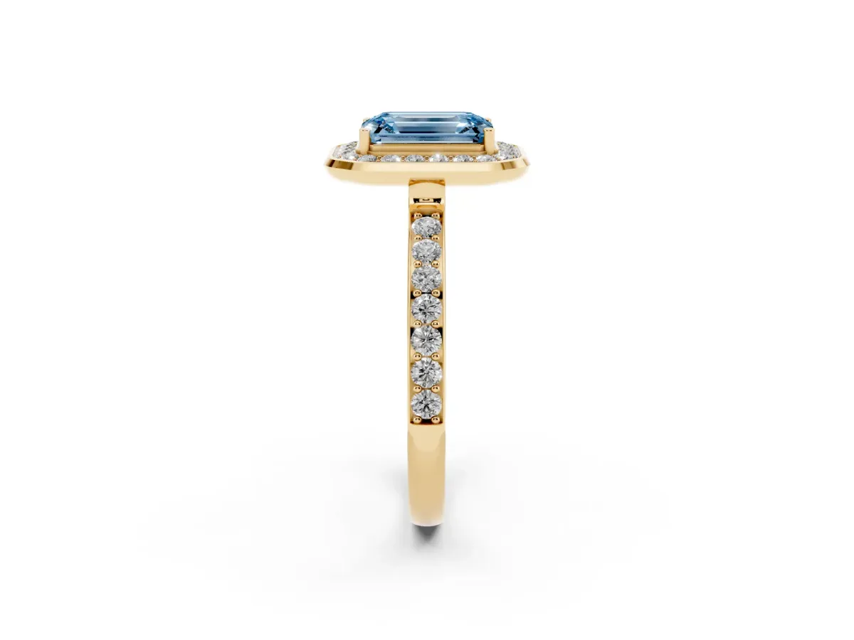Fancy Blue Emerald Cut Diamond Halo Ring with Bezel Frame and Pavé Band Yellow gold