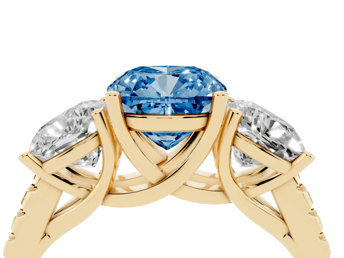 Fancy Blue Three-Stone Cushion Cut Diamond Ring with Round Pavé Band and Prong Setting Yellow gold