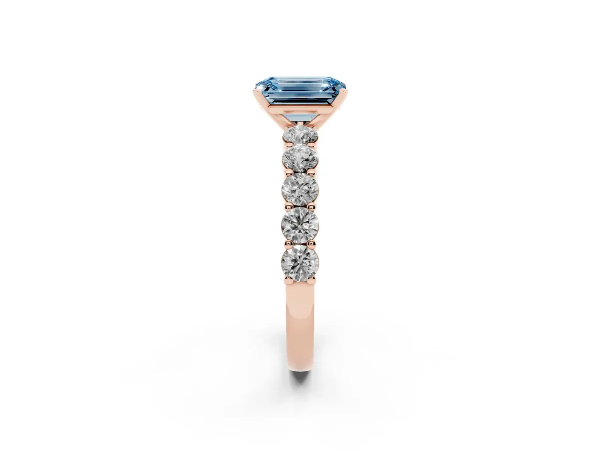 Fancy Blue Emerald Cut Diamond Solitaire Ring with Shared Prong Round Side Stones Rose gold