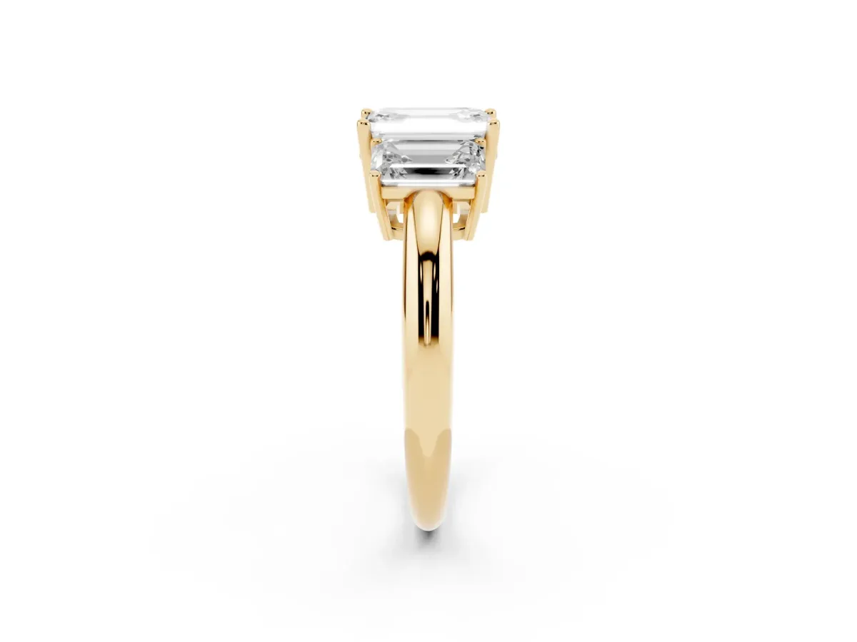 Three-Stone Emerald Cut Cut Diamond Engagement Ring with Prong Setting on a White Gold Band Yellow gold