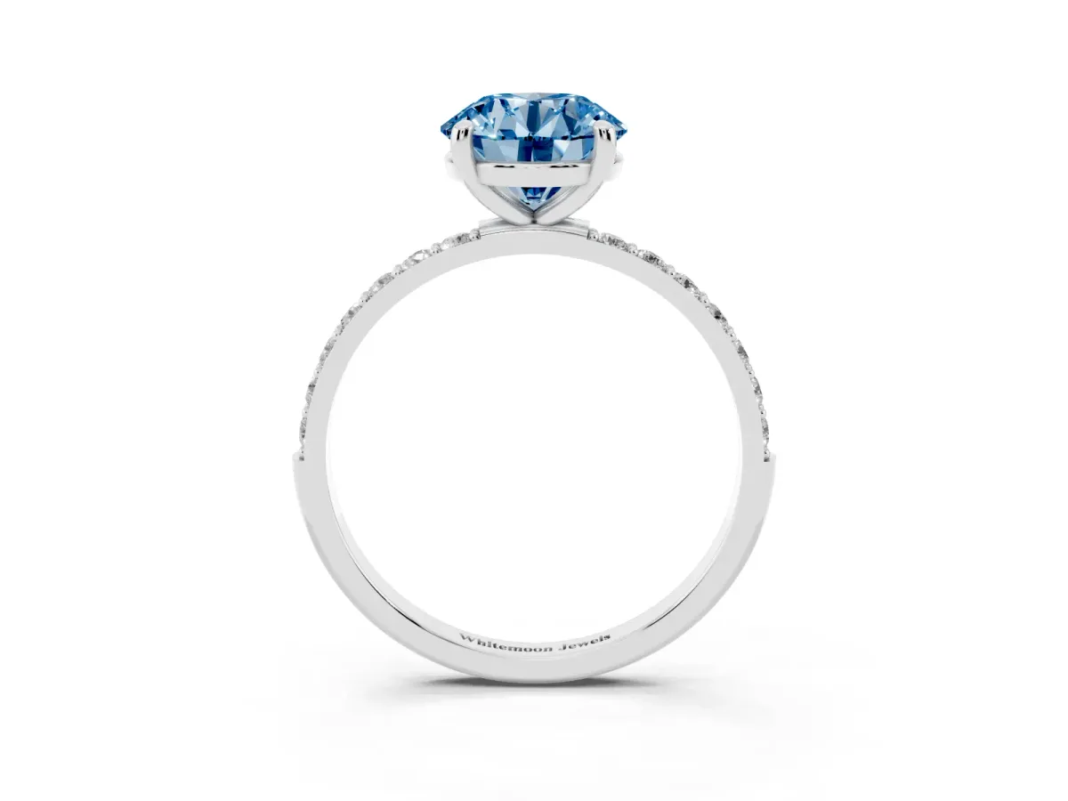 Fancy Blue Round Cut Diamond Solitaire Ring with Round Pavé Band and Prong Setting Silver