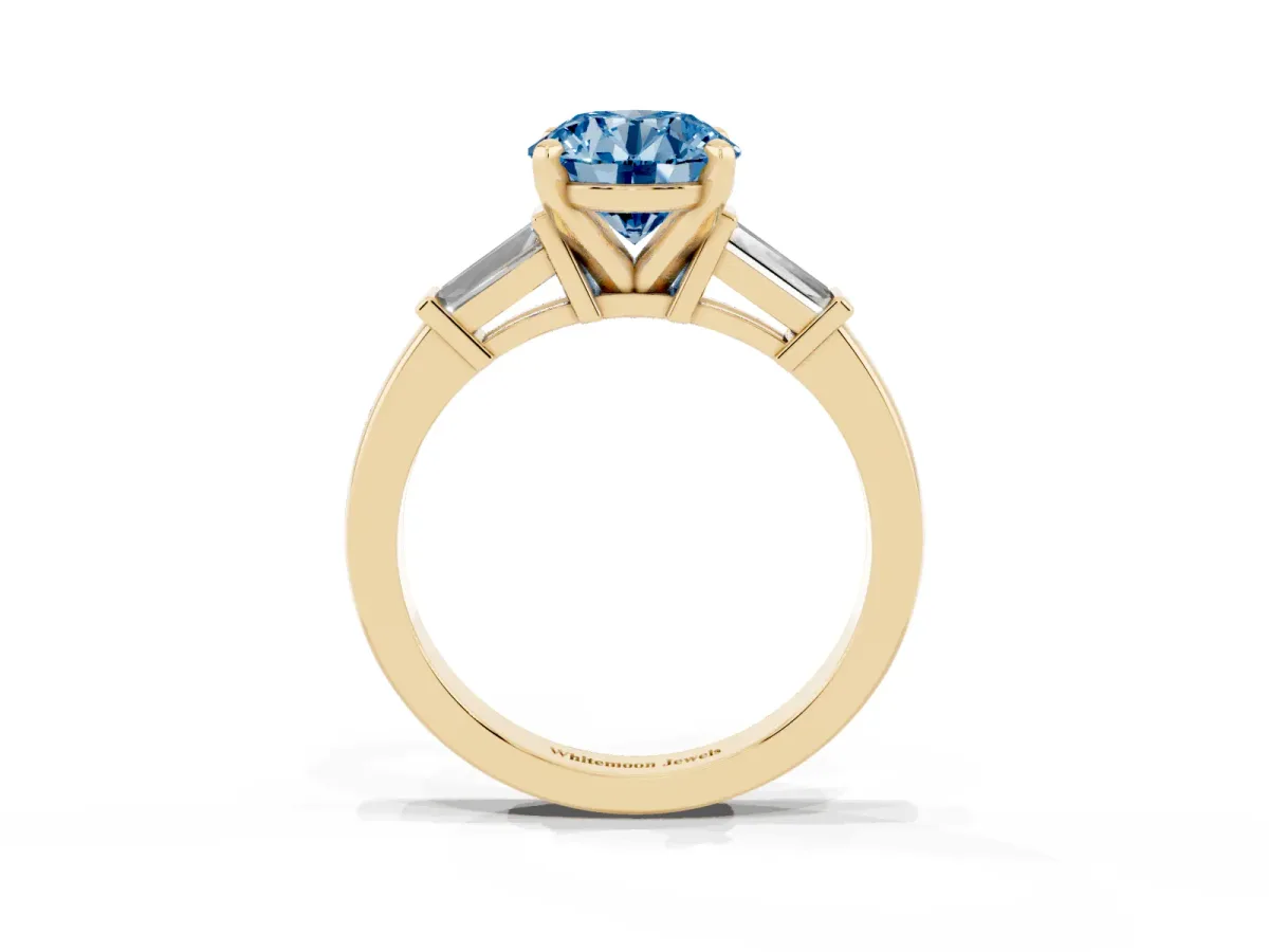 Fancy Blue Round Cut Cut Diamond Solitaire Ring with Tapered Baguette Accents and Four-Prong Setting Yellow gold