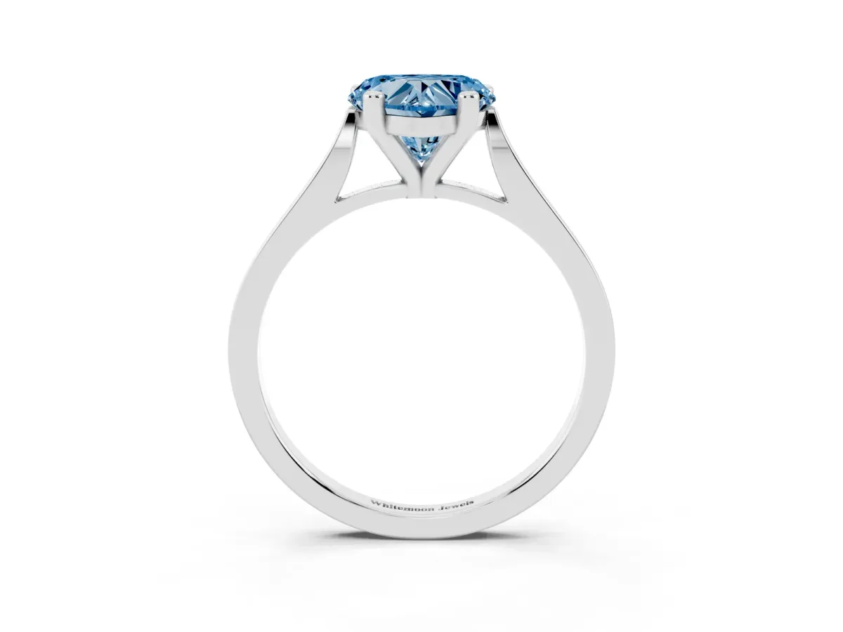 Fancy Blue Heart Cut Solitaire Diamond Ring with Four-Prong Setting and Tapered Band Platinum