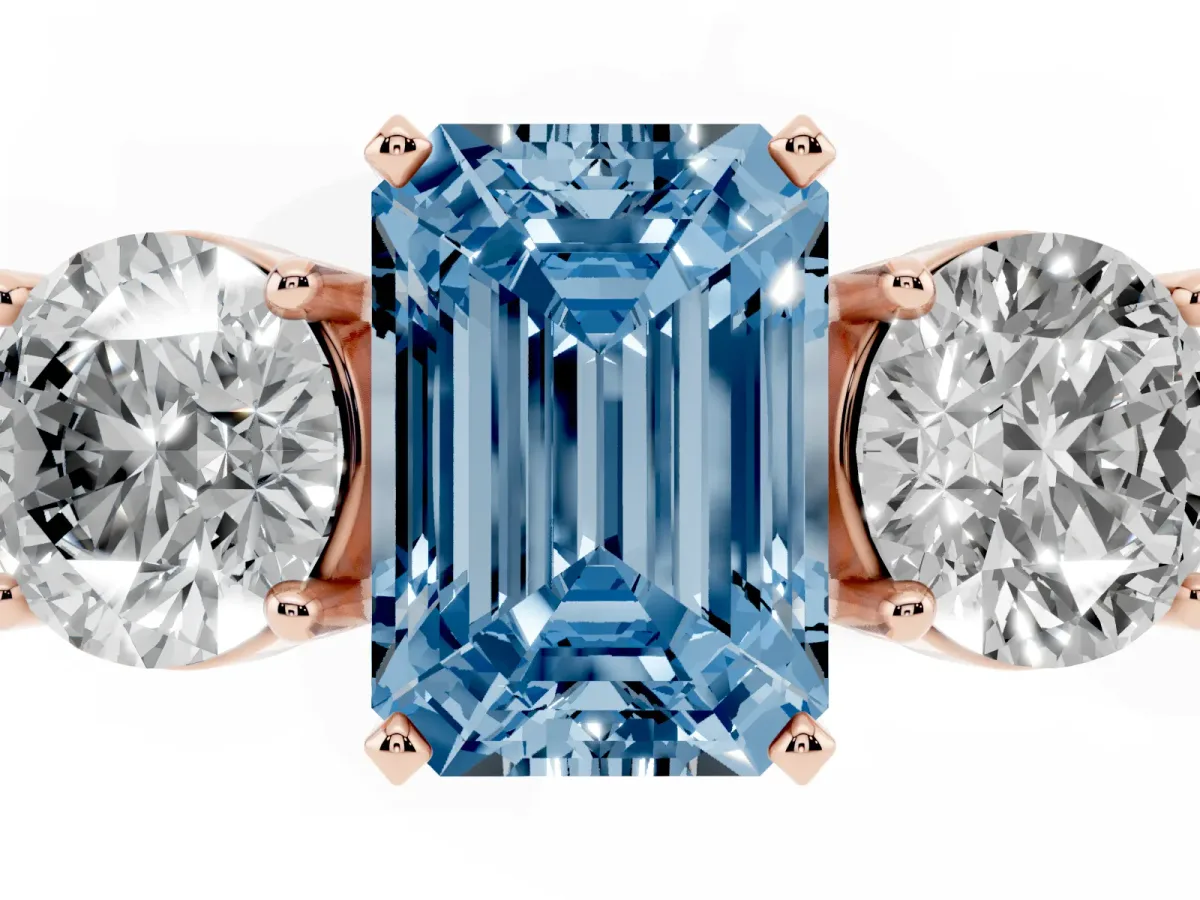 Fancy Blue Three-Stone Emerald Cut Diamond Ring with Round Side Stones, Classic Band, and Four-Prong Setting Rose gold